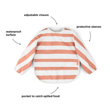 Done by Deer Waterproof bib with sleeves | Stripes papaya